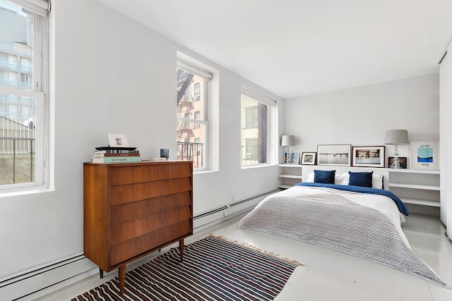 bedroom featuring a baseboard heating unit