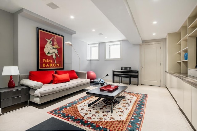 living area with visible vents and recessed lighting