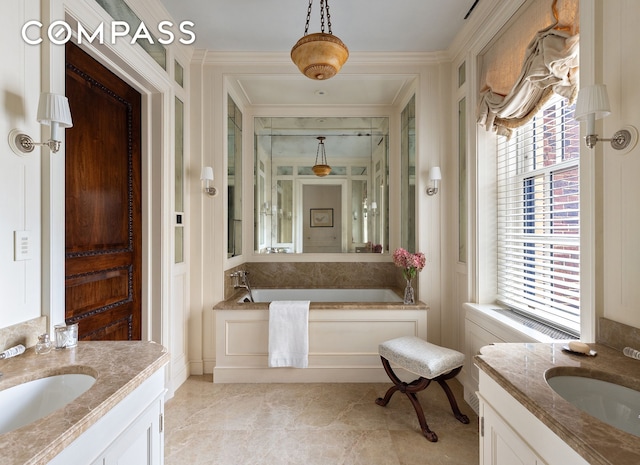 bathroom with a sink, two vanities, and a bath