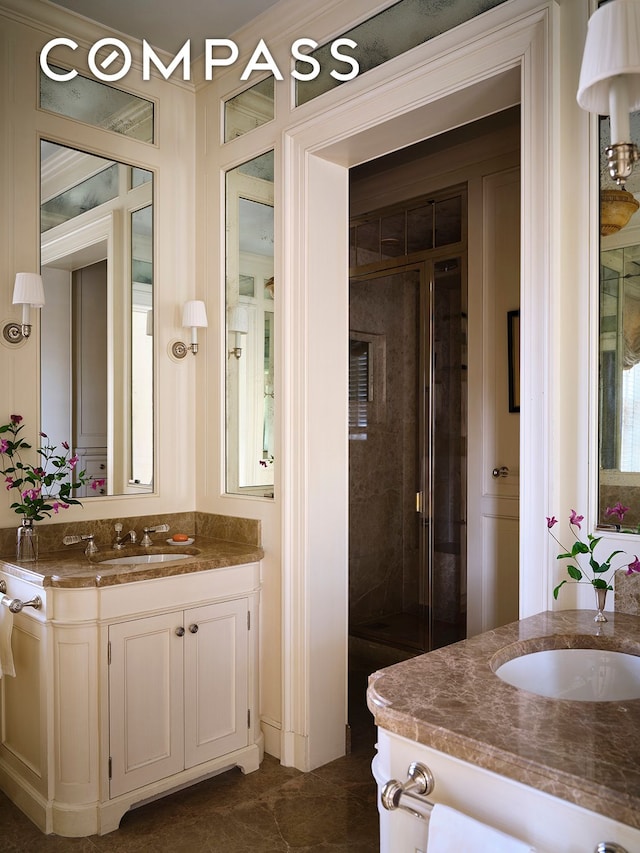 bathroom featuring a stall shower and vanity