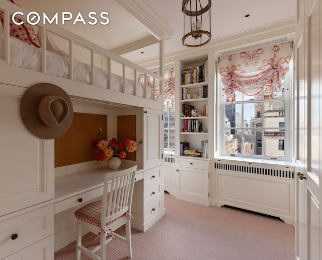 bedroom featuring radiator and light carpet