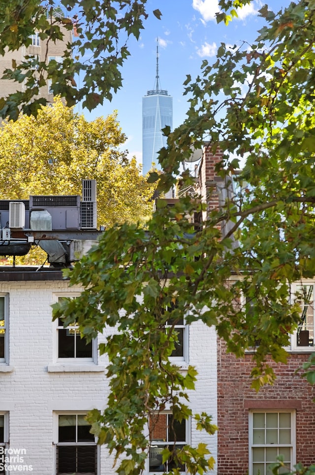 exterior space featuring brick siding