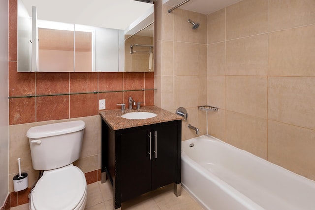 full bath featuring toilet, shower / tub combination, tile patterned flooring, vanity, and tile walls