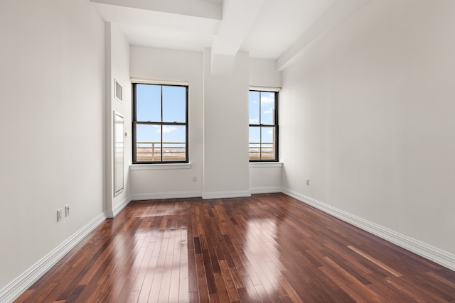 spare room with dark hardwood / wood-style floors