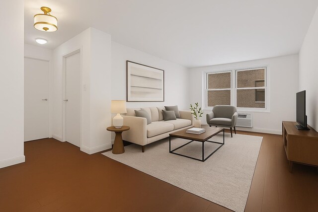 living room with baseboards, a wall unit AC, and dark wood-style floors