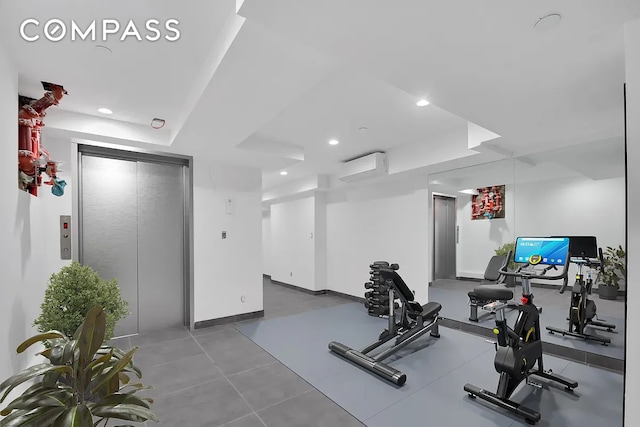 workout room with elevator, recessed lighting, a wall mounted air conditioner, and baseboards