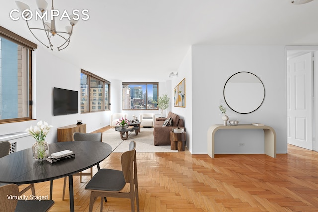 dining space with a notable chandelier and baseboards