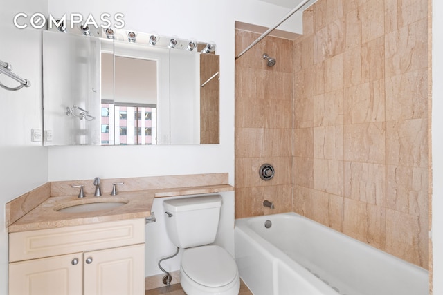 full bathroom with bathtub / shower combination, toilet, and vanity