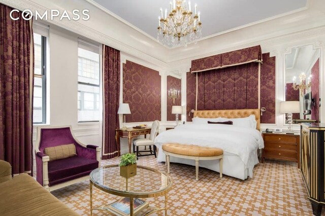 bedroom with crown molding and a notable chandelier