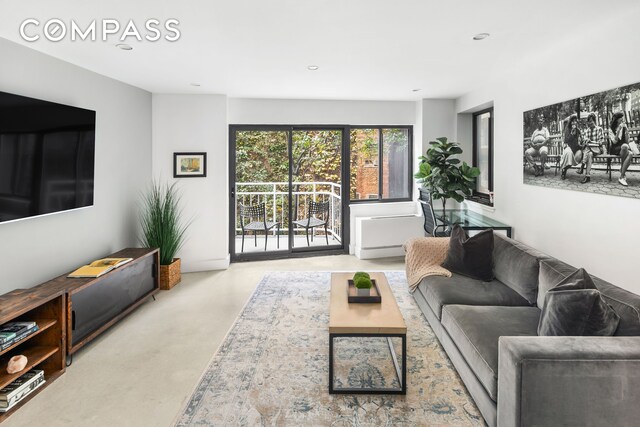 living room with concrete flooring