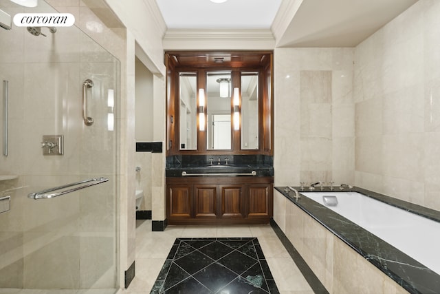 full bathroom featuring separate shower and tub, vanity, tile walls, toilet, and tile patterned floors