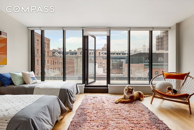 51 Jay St Phe, Phe, New York City, NY 11201 - bedroom with wood finished floors, a wall of windows, and a view of city