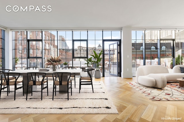 dining room with expansive windows and a city view