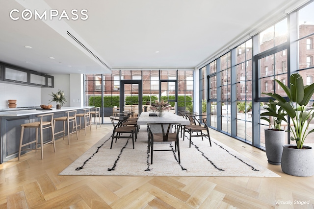 dining room with french doors and floor to ceiling windows