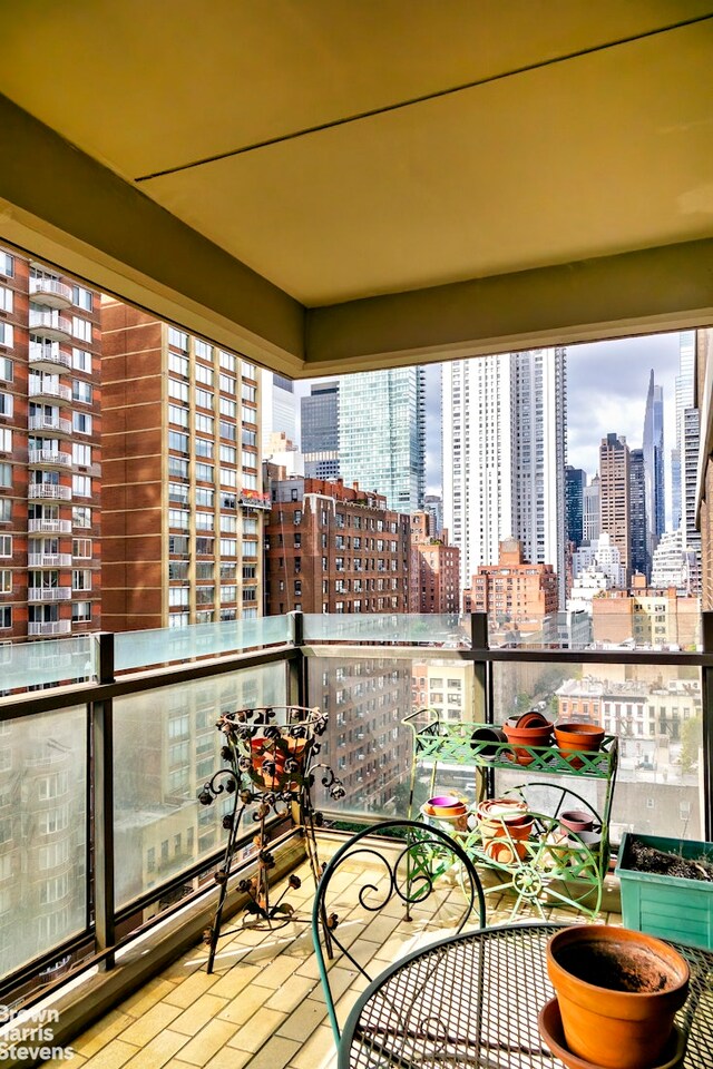 425 E 58th St Unit 14D, New York City, NY 10022 - balcony with a skyline view