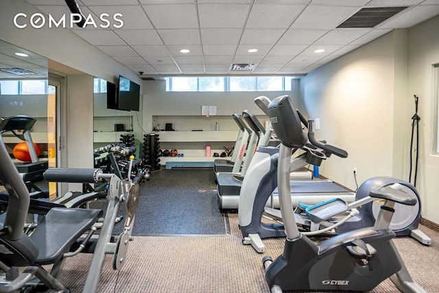 workout area featuring a drop ceiling