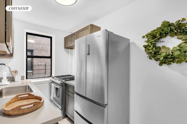 kitchen with appliances with stainless steel finishes and sink