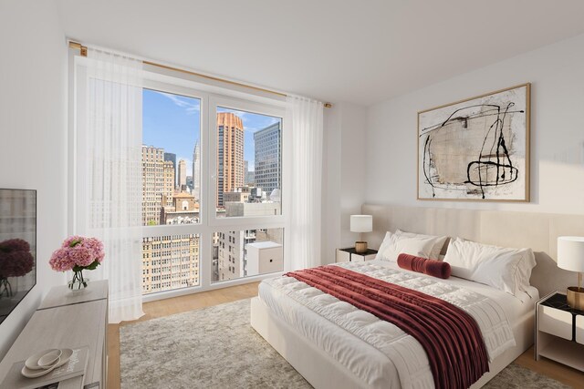 39 E 29th St Unit 25A, New York City, NY 10016 - bedroom featuring wood finished floors and a view of skyline