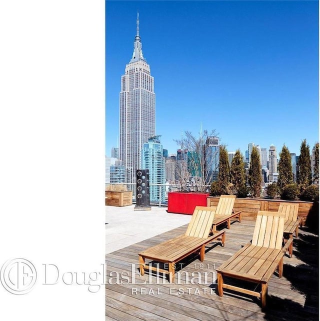 39 E 29th St Unit 25A, New York City, NY 10016 - wooden terrace featuring a skyline view