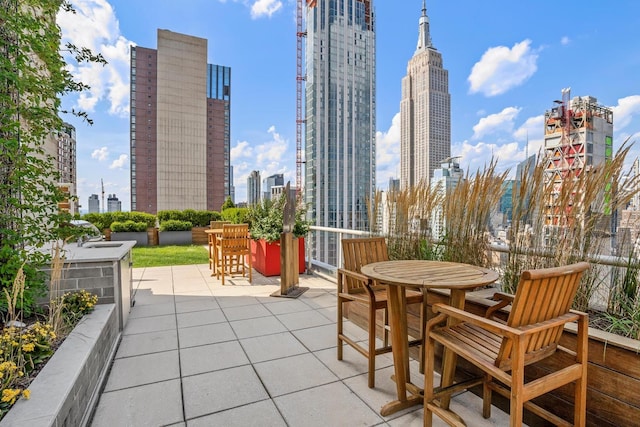 39 E 29th St Unit 25A, New York City, NY 10016 - view of patio featuring a view of skyline and outdoor dining area