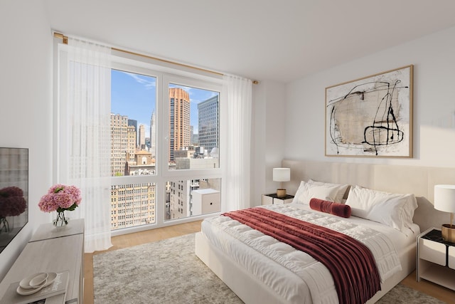 39 E 29th St Unit 25A, New York City, NY 10016 - bedroom featuring wood finished floors and a view of skyline