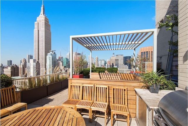 39 E 29th St Unit 25A, New York City, NY 10016 - view of patio / terrace featuring a skyline view, a pergola, and area for grilling