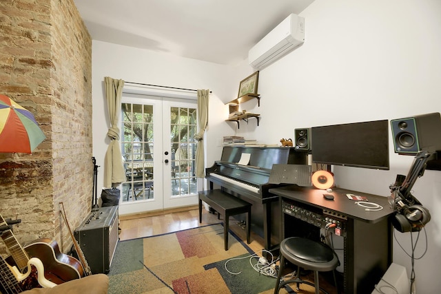 home office with brick wall, french doors, and a wall mounted air conditioner