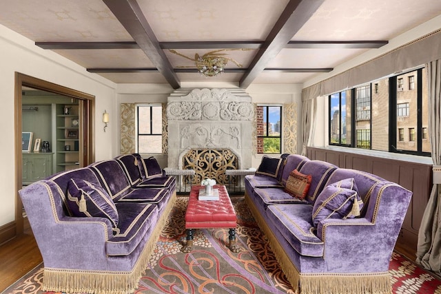 living room featuring hardwood / wood-style flooring, plenty of natural light, beamed ceiling, and coffered ceiling