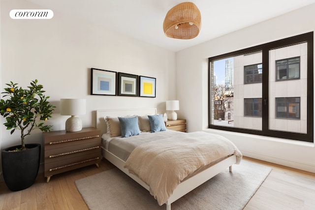 bedroom with wood finished floors and visible vents