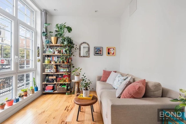 sitting room with hardwood / wood-style floors