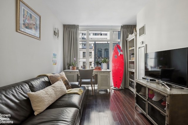 living room with visible vents and dark wood-style flooring