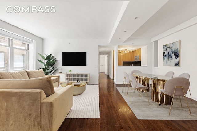 living room featuring dark wood finished floors and baseboards