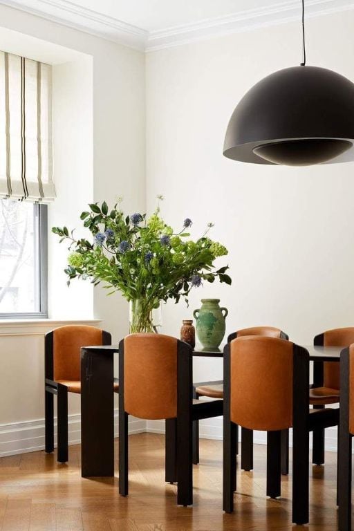 dining space with ornamental molding