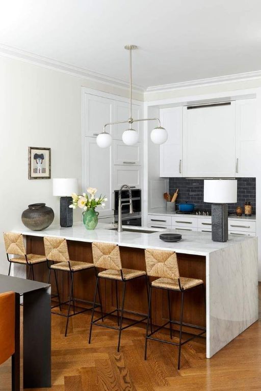 kitchen with pendant lighting, sink, white cabinets, decorative backsplash, and ornamental molding