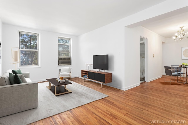 221 Mcdonald Ave Unit 3A, New York City, NY 11218 - living room featuring wood finished floors and a chandelier