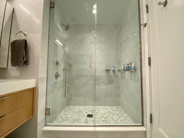 full bath with a shower stall