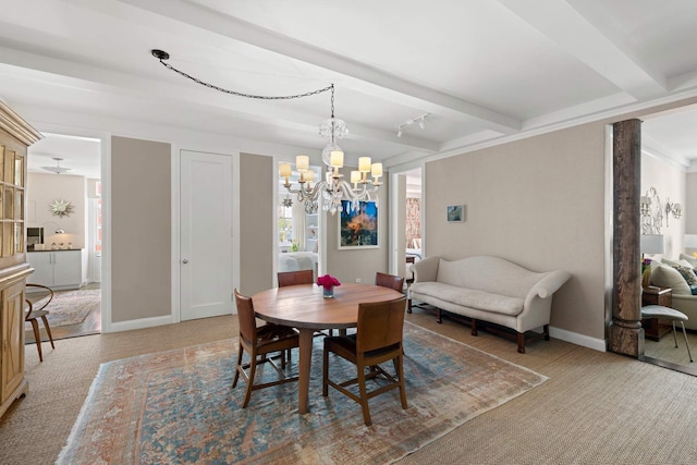 carpeted dining room with an inviting chandelier, beam ceiling, and baseboards