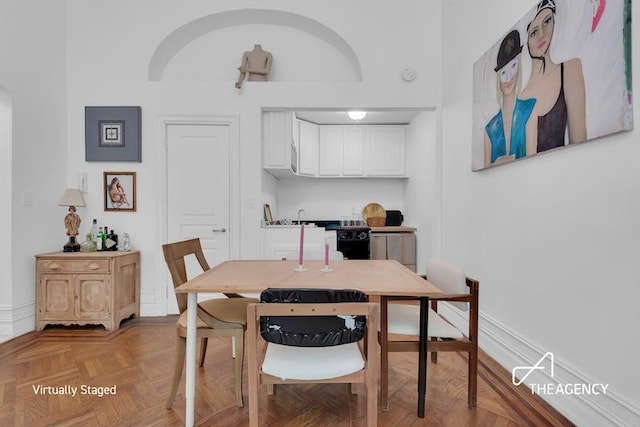 dining area featuring light parquet floors