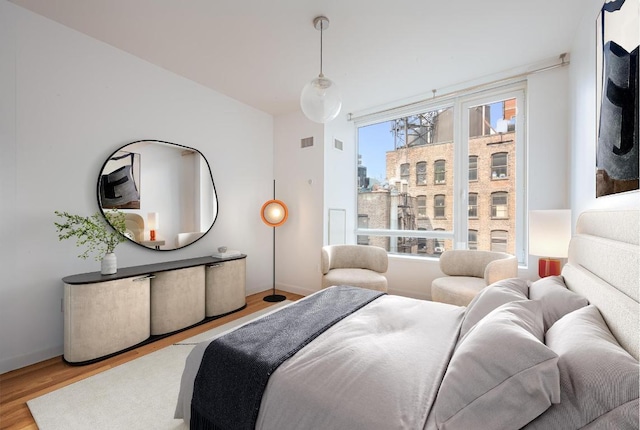 bedroom with light hardwood / wood-style flooring