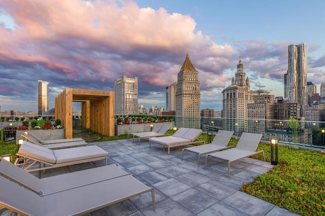 view of patio terrace at dusk