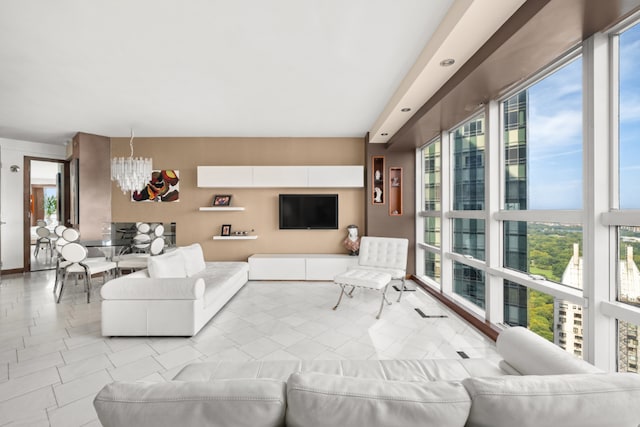 tiled living room featuring a chandelier