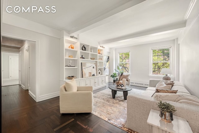 sitting room with dark parquet flooring, beam ceiling, and baseboard heating