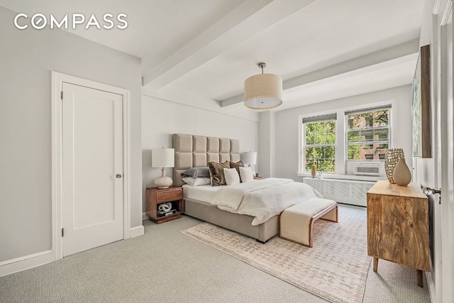 carpeted bedroom featuring radiator and beam ceiling