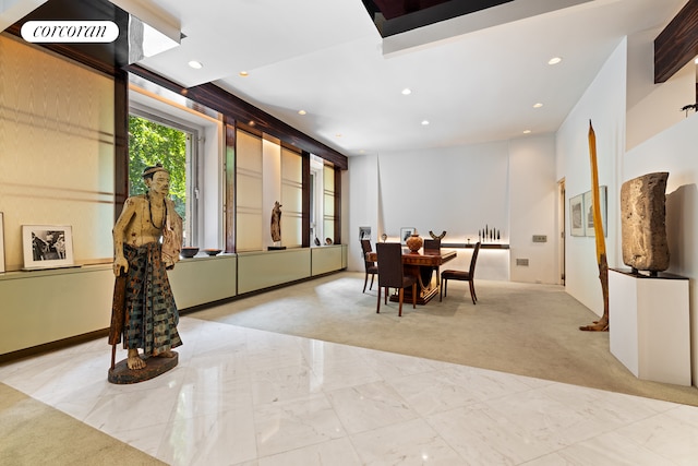 dining space with recessed lighting and marble finish floor