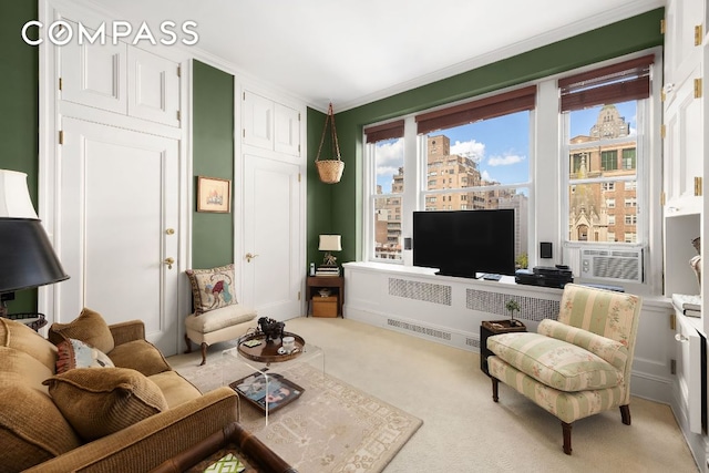 carpeted living room with cooling unit, ornamental molding, and a wealth of natural light