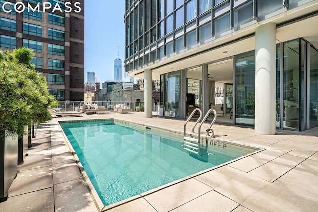 view of swimming pool with a patio area