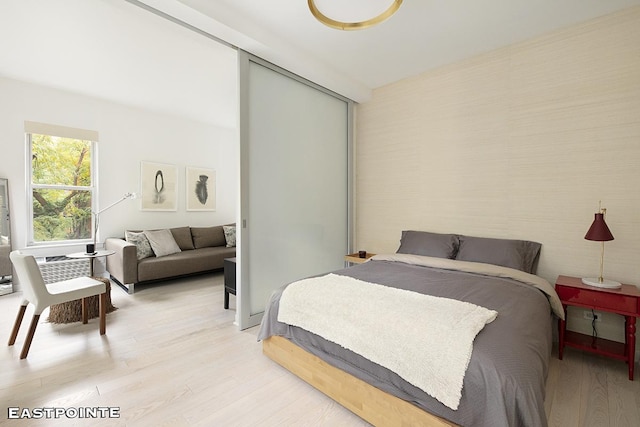 bedroom featuring light wood finished floors