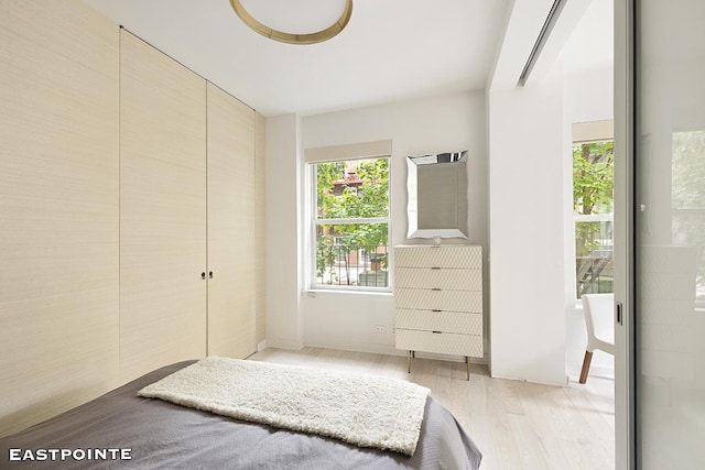 bedroom with light wood-type flooring