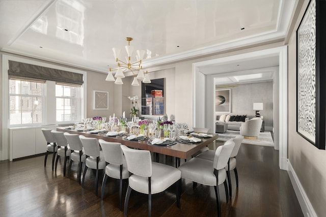 dining room featuring crown molding, a notable chandelier, and dark wood finished floors