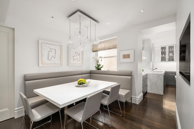 dining area featuring recessed lighting and dark wood finished floors
